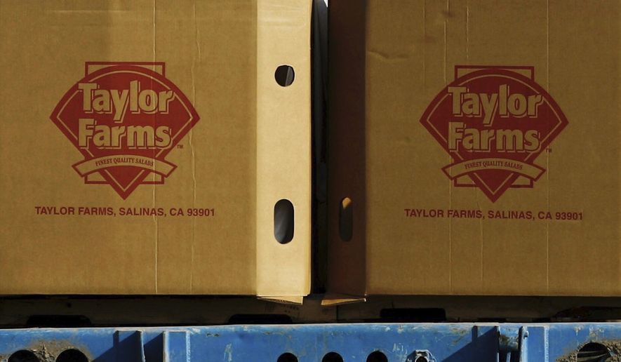 FILE - Taylor Farms boxes are loaded on a field in the town of Doctor Mora, on the central state of Guanajuato, Mexico, March 26, 2008. (AP Photo/Guillermo Arias, file)