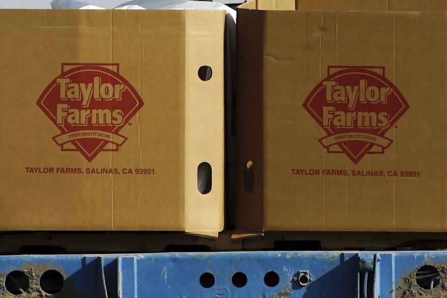 FILE - Taylor Farms boxes are loaded on a field in the town of Doctor Mora, on the central state of Guanajuato, Mexico, March 26, 2008. (AP Photo/Guillermo Arias, file)