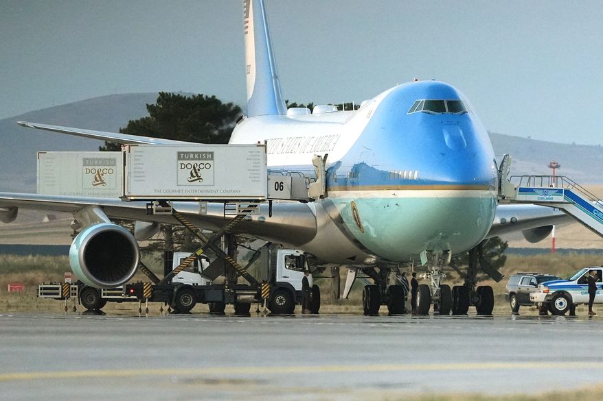 Catering trucks are parked at Air Force One on the tarmac as the motorcade carrying U.S. President Donald Trump arrives on the tarmac to depart following the NATO summit at Ankara International Airport in Ankara, Turkey, Wednesday, July 8, 2026. (AP Photo/Alex Brandon)