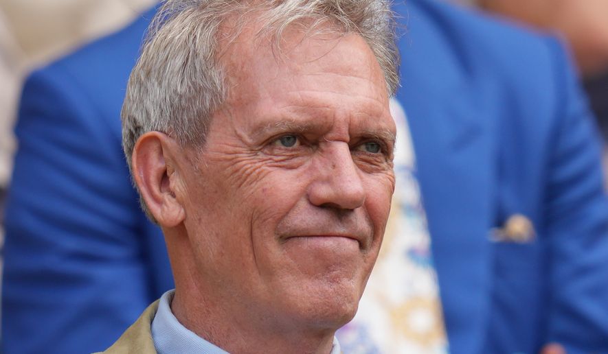 Actor Hugh Laurie watches from the Royal Box as play in the men's singles semifinal matches begins at the Wimbledon Tennis Championships in London, Friday, July 10, 2026. (AP Photo/Kirsty Wigglesworth)