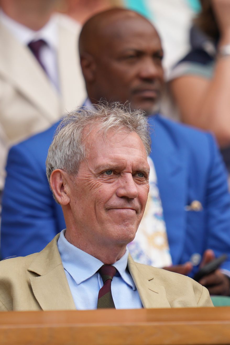 Actor Hugh Laurie watches from the Royal Box as play in the men's singles semifinal matches begins at the Wimbledon Tennis Championships in London, Friday, July 10, 2026. (AP Photo/Kirsty Wigglesworth)