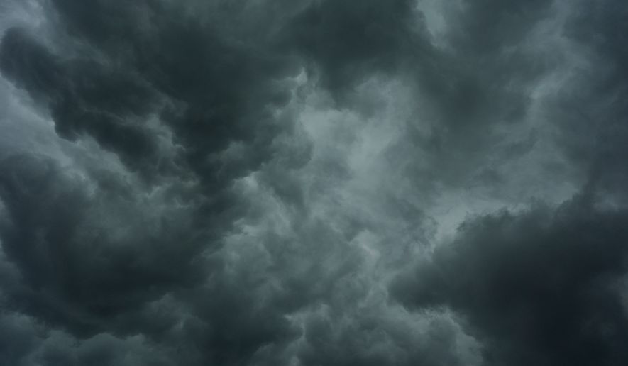 Storm clouds are seen over the Cincinnati Bengals NFL football practice in Cincinnati, Tuesday, Aug. 11, 2026. (AP Photo/Carolyn Kaster)