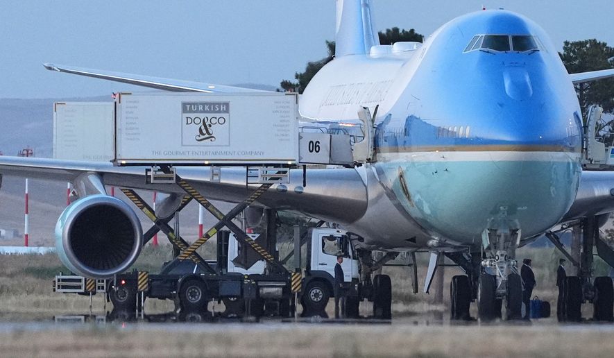 Catering trucks are parked at Air Force One on the tarmac as the motorcade carrying U.S. President Donald Trump arrives to depart following the NATO summit at Ankara International Airport in Ankara, Turkey, Wednesday, July 8, 2026. (AP Photo/Alex Brandon)