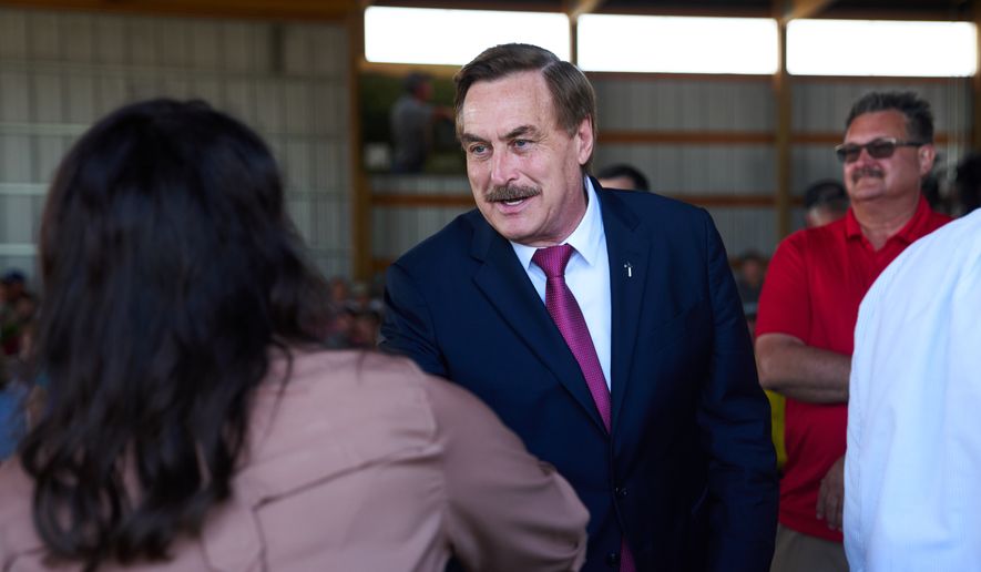 Mike Lindell, gubernatorial candidate, greets Minnesota House Speaker Lisa Demuth as they arrive to take part in a Minnesota Governor Candidate Forum in Morgan, Minn., Wednesday, Aug. 5, 2026. (AP Photo/Ellen Schmidt) ** FILE **