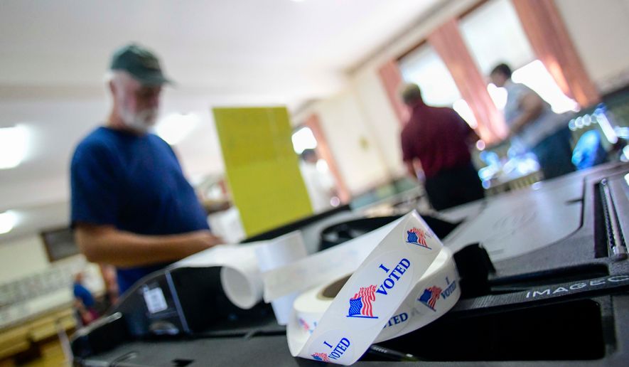 Sean Reid of Rockingham, Vt., casts his ballot at the polling station in Rockingham during Vermont's state and federal primary elections on Tuesday, Aug. 11, 2026. (Kristopher Radder/The Brattleboro Reformer via AP)