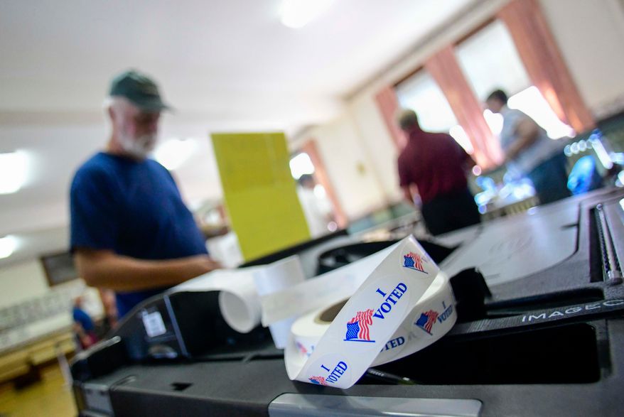 Sean Reid of Rockingham, Vt., casts his ballot at the polling station in Rockingham during Vermont's state and federal primary elections on Tuesday, Aug. 11, 2026. (Kristopher Radder/The Brattleboro Reformer via AP)