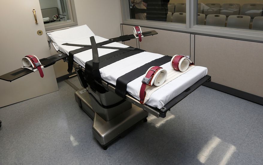 FILE - This Oct. 9, 2014, file photo shows the gurney in the the execution chamber at the Oklahoma State Penitentiary in McAlester, Okla. (AP Photo/Sue Ogrocki, File)