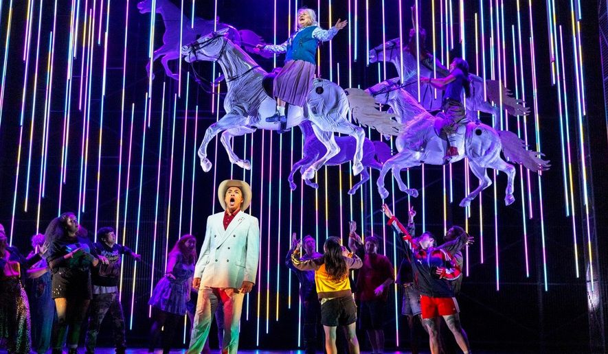 This image released by the Scottish Opera shows Justin Austin, foreground center, and Susan Bullock, top center, during a performance of "The Galloping Cure," at Theatre Royal Glasgow on July 28, 2026 in Glasgow, Scotland. (Antonia Bain/Scottish Opera via AP)