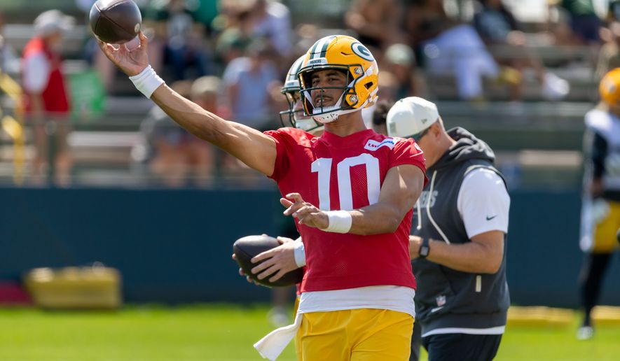 Green Bay Packers quarterback Jordan Love (10) participates in drills during the NFL football team's training camp, Sunday, Aug. 2, 2026, in Green Bay, Wis. (AP Photo/Mike Roemer)