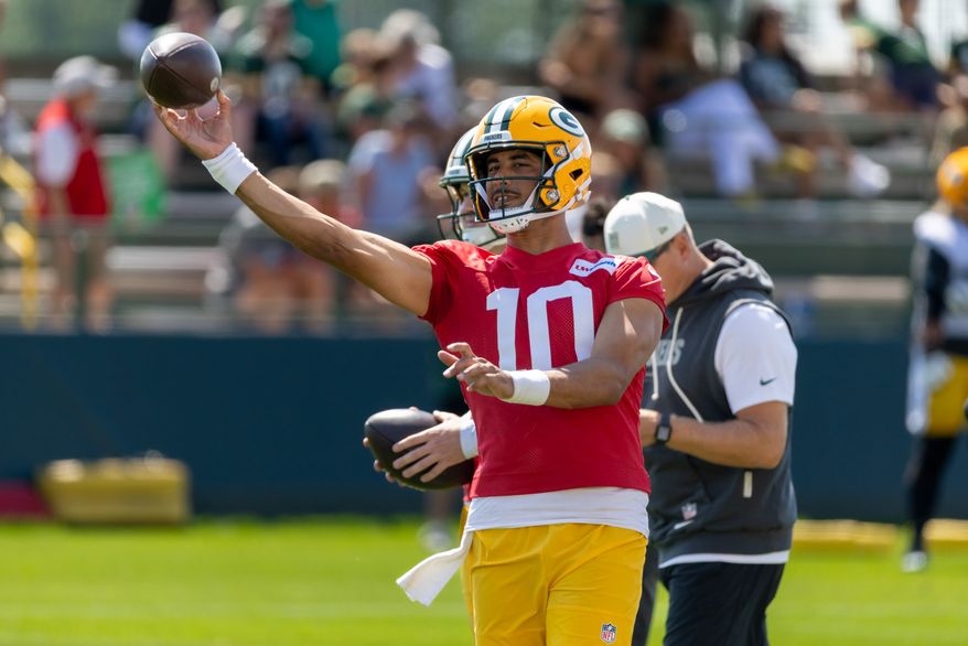 Green Bay Packers quarterback Jordan Love (10) participates in drills during the NFL football team's training camp, Sunday, Aug. 2, 2026, in Green Bay, Wis. (AP Photo/Mike Roemer)