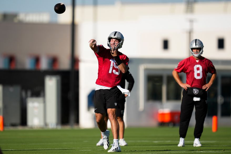 Las Vegas Raiders quarterback Fernando Mendoza (15) throws during practice at the team's NFL football training camp, Wednesday, July 29, 2026, in Henderson, Nev. (AP Photo/Lucas Peltier)