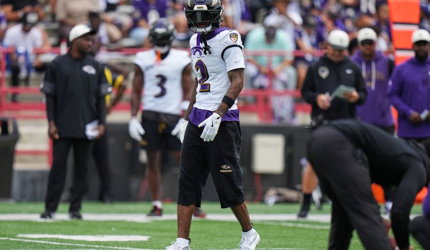 Baltimore Ravens cornerback Nate Wiggins (2) works out during the team's NFL football training camp, Saturday, Aug. 1, 2026, at the University of Maryland in College Park, Md. (AP Photo/Stephanie Scarbrough)