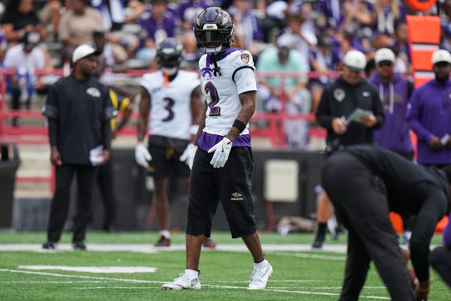 Baltimore Ravens cornerback Nate Wiggins (2) works out during the team's NFL football training camp, Saturday, Aug. 1, 2026, at the University of Maryland in College Park, Md. (AP Photo/Stephanie Scarbrough)
