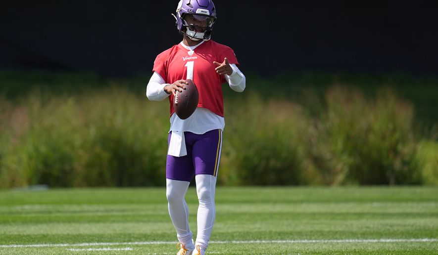 Minnesota Vikings quarterback Kyler Murray stands on the field during the NFL football team's training camp Saturday, Aug. 1, 2026, in Eagan, Minn. (AP Photo/Abbie Parr)