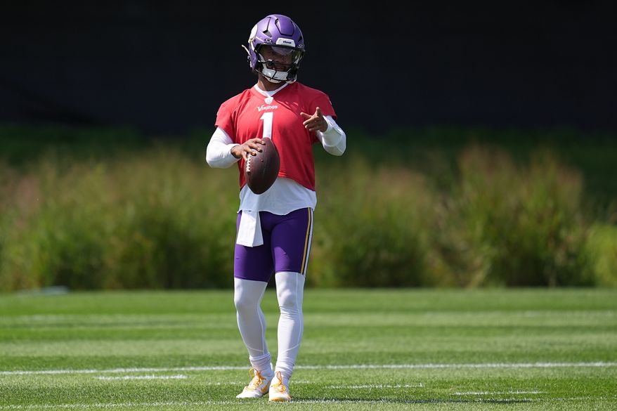 Minnesota Vikings quarterback Kyler Murray stands on the field during the NFL football team's training camp Saturday, Aug. 1, 2026, in Eagan, Minn. (AP Photo/Abbie Parr)