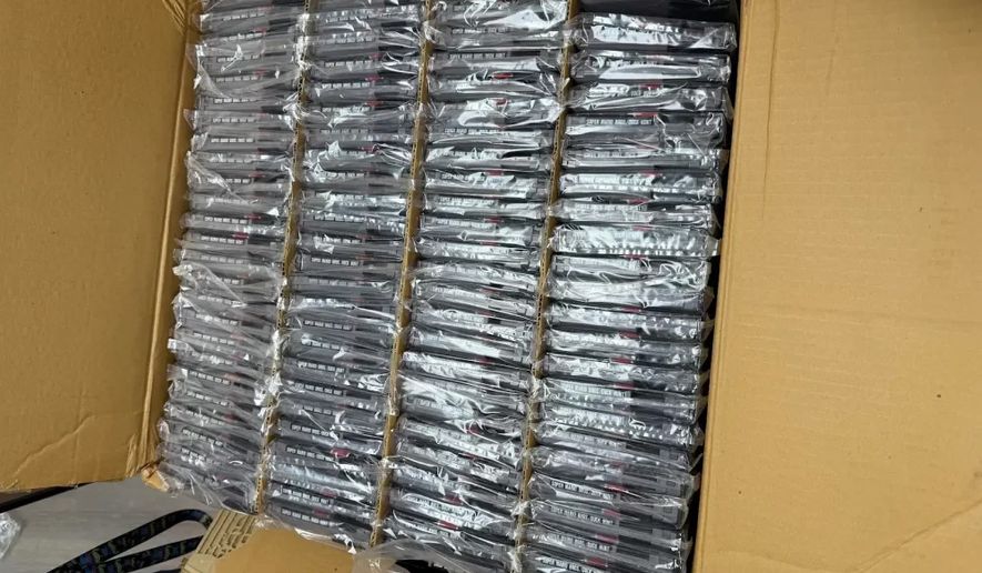 This photo provided by Nintendo Wire shows a box of nearly 100 uncirculated Nintendo Entertainment System copies of Super Mario Bros. and Duck Hunt on Wednesday, June 17, 2026, rediscovered in a warehouse in Waukesha, Wis., by OneStopWonders store owner Kevin Braun and Nintendo Wire publisher Jason Ganos. (Jason Ganos/Nintendo Wire via AP)