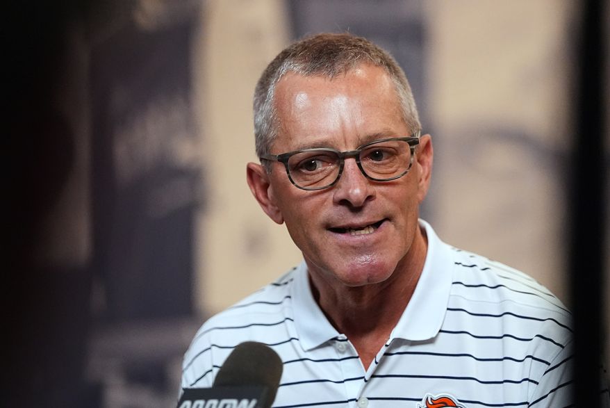 Denver Broncos co-owner and chief executive officer Greg Penner talks to reporters at the team's NFL football training camp in Centennial, Colo., Tuesday, Aug. 11, 2026. (AP Photo/David Zalubowski)