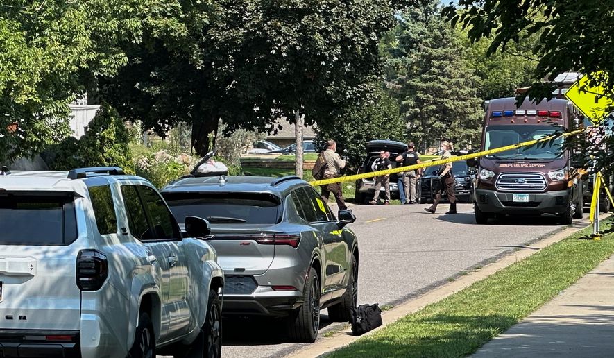 Law enforcement respond to a call at a home daycare, Wednesday, Aug. 12, 2026, in Hopkins, Minn. (AP Photo/Mark Vancleave)