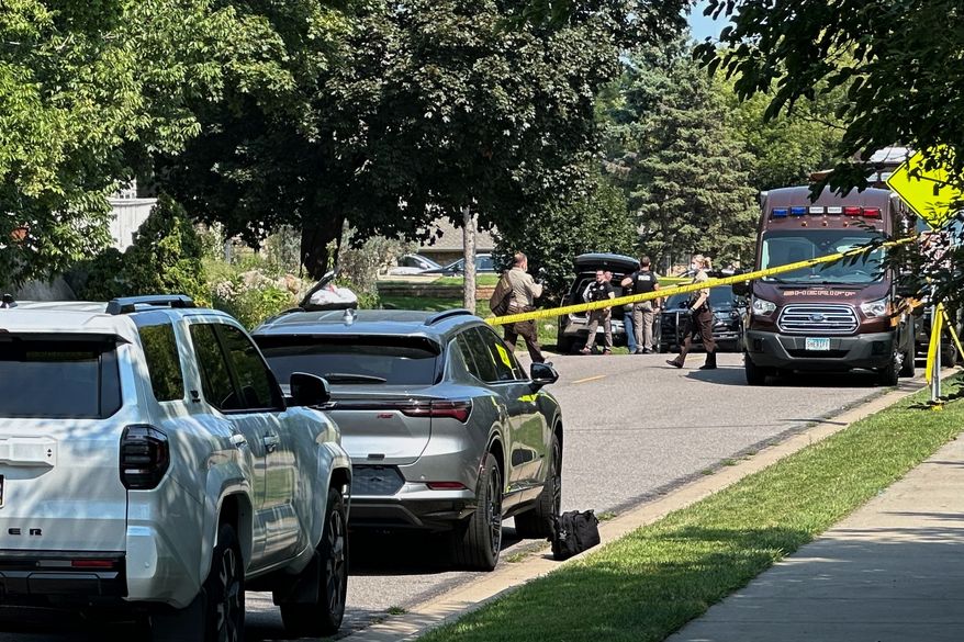 Law enforcement respond to a call at a home daycare, Wednesday, Aug. 12, 2026, in Hopkins, Minn. (AP Photo/Mark Vancleave)