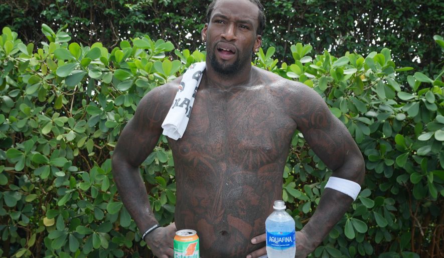 Miami Dolphins defensive line Kahlil Saunders speaks after the team's NFL football training camp, Monday, Aug. 3, 2026, in Miami Gardens, Fla. (AP Photo/Marta Lavandier)