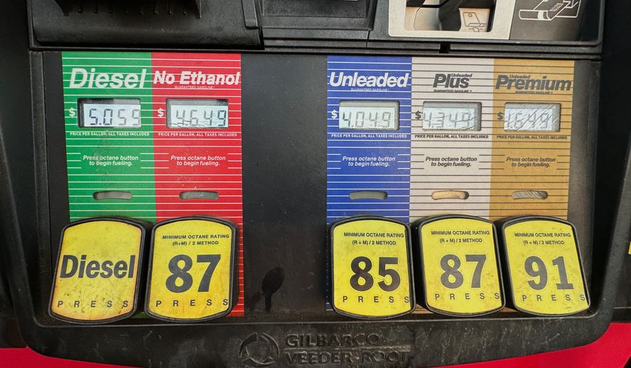 Gas prices are displayed electronically at QT gasoline station, Thursday, Aug. 6, 2026, in Greenwood Village, Colo. (AP Photo/David Zalubowski)