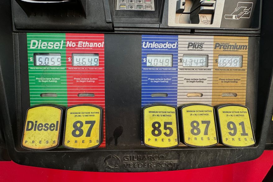 Gas prices are displayed electronically at QT gasoline station, Thursday, Aug. 6, 2026, in Greenwood Village, Colo. (AP Photo/David Zalubowski)