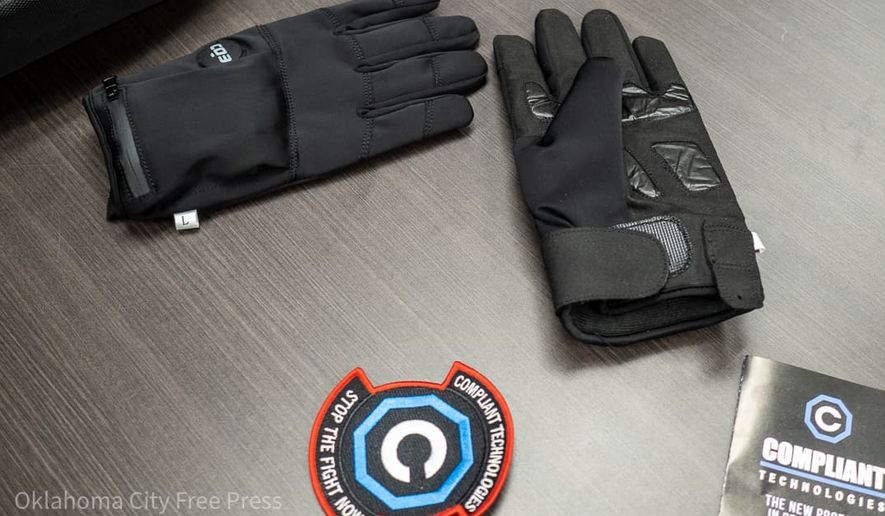 The G.L.O.V.E., developed by Compliant Technologies LLC, sits on a table after a demonstration at the Oklahoma County Detention Center in Oklahoma City, March 22, 2023. (Brett Dickerson/Oklahoma City Free Press via AP)