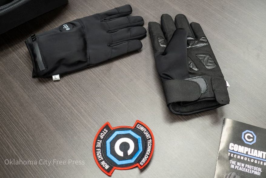 The G.L.O.V.E., developed by Compliant Technologies LLC, sits on a table after a demonstration at the Oklahoma County Detention Center in Oklahoma City, March 22, 2023. (Brett Dickerson/Oklahoma City Free Press via AP)