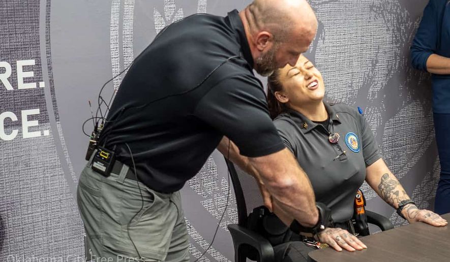 This photo provided by the Oklahoma City Free Press shows Justin Morris demonstrating the G.L.O.V.E. at the Oklahoma County Detention Center in Oklahoma City, March 22, 2023. (Brett Dickerson/Oklahoma City Free Press via AP)