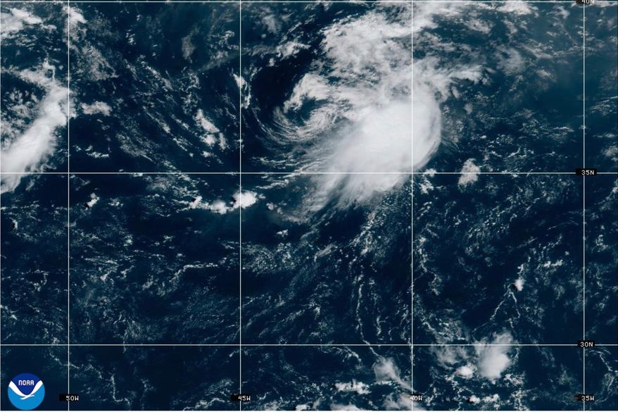 This NOAA satellite image taken at 11:21 a.m. EST on Wednesday, Aug. 12, 2026, shows Tropical Storm Cristobal in the Atlantic Ocean. (NOAA via AP)