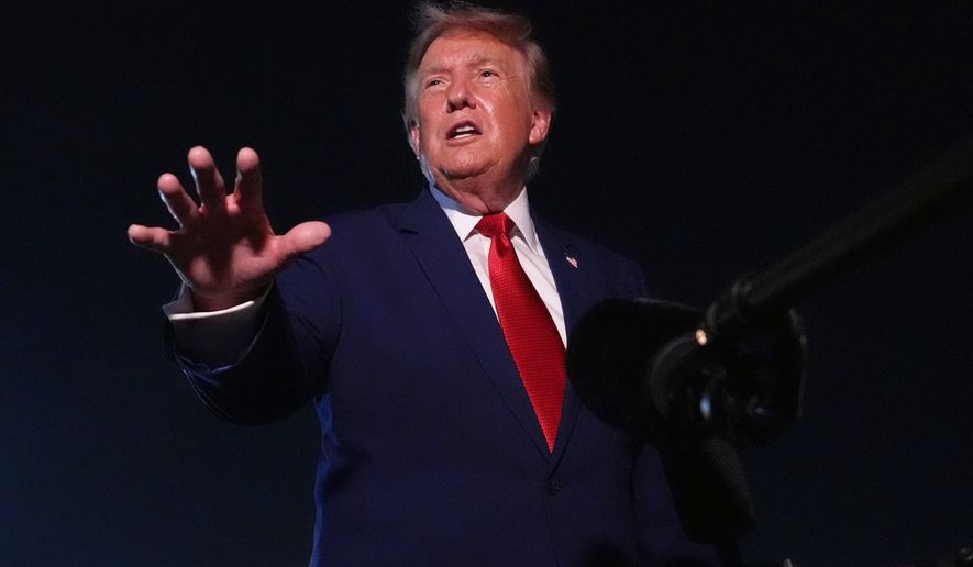 President Donald Trump talks to reporters after arriving on Air Force One Tuesday, Aug. 11, 2026, at Joint Base Andrews, Md. (AP Photo/Mark Schiefelbein)