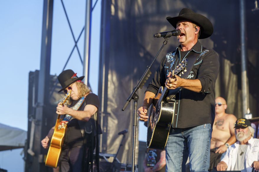 Big Kenny, left, and John Rich, of the band Big & Rich, perform during Patriots Fest on Saturday, May 18, 2024, in Aurora, Ill. (Photo by Rob Grabowski/Invision/AP)