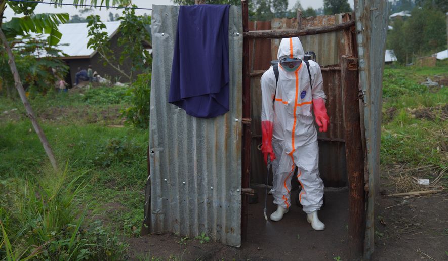 Wiza Bondele, a health worker on the prevention and control team, is seen at work in Ituri province, eastern Congo, Wednesday, Aug 5, 2026. (AP Photo/Dieudonne Dirole)