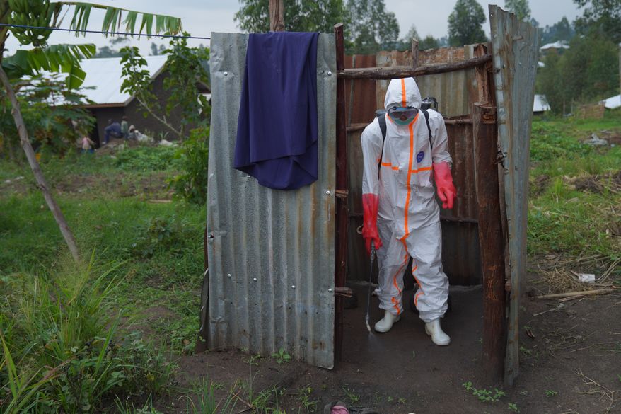 Wiza Bondele, a health worker on the prevention and control team, is seen at work in Ituri province, eastern Congo, Wednesday, Aug 5, 2026. (AP Photo/Dieudonne Dirole)