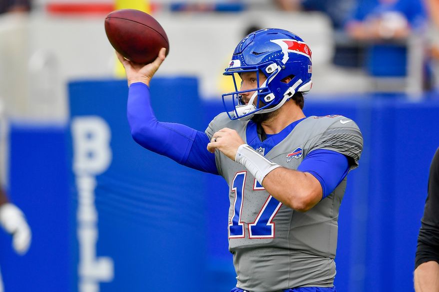 Buffalo Bills quarterback Josh Allen looks to throw during practice at the team's NFL football training camp Saturday, Aug. 8, 2026, in Orchard Park, N.Y. (AP Photo/Adrian Kraus)