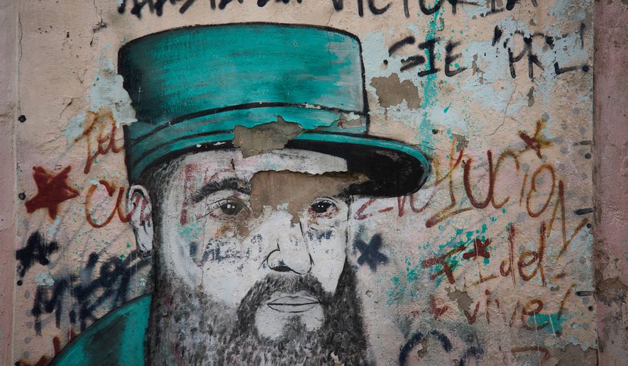 A weathered mural of Fidel Castro covers a wall in Havana, Cuba, Wednesday, Aug. 12, 2026. (AP Photo/Ramon Espinosa)