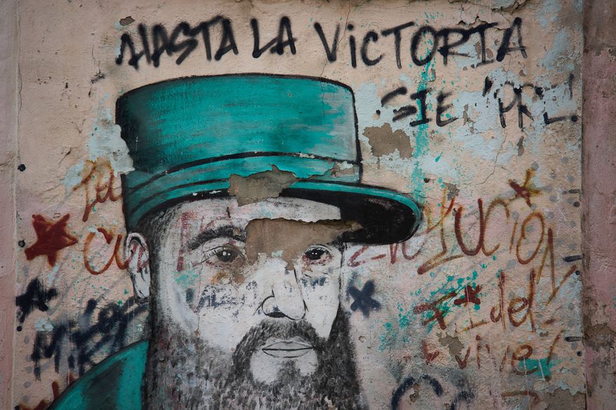 A weathered mural of Fidel Castro covers a wall in Havana, Cuba, Wednesday, Aug. 12, 2026. (AP Photo/Ramon Espinosa)