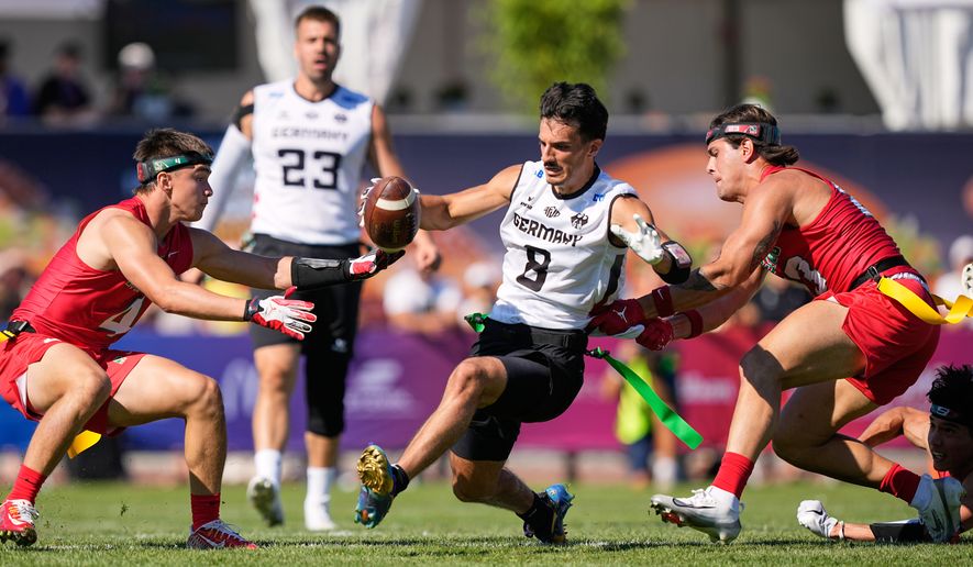 Germany's Malik Al-Kahlout runs with the ball during the Flag Football World Championship men's match between Mexico and Germany in Duesseldorf, Germany, Thursday, Aug. 13, 2026. (AP Photo/Martin Meissner)
