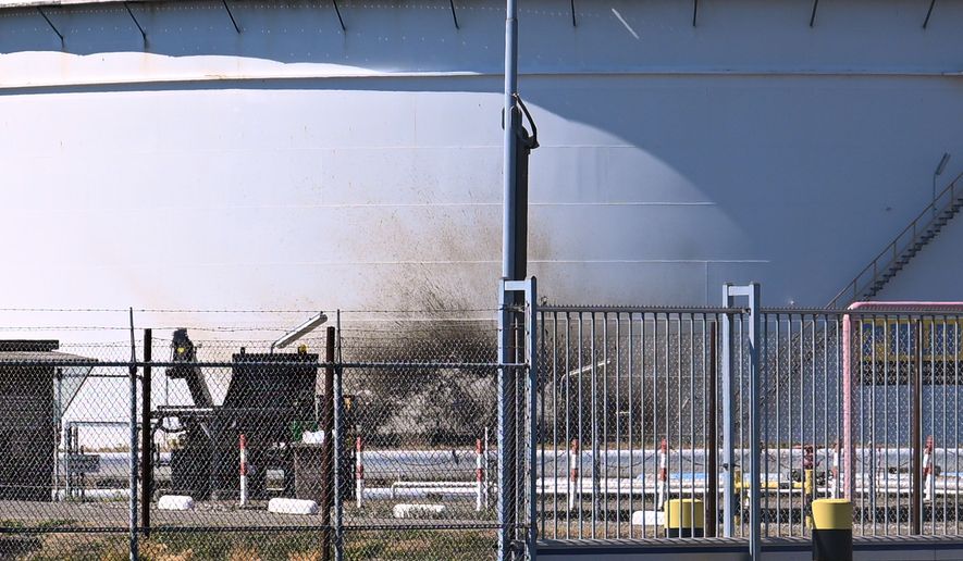 A structure in a refinery and fuel terminal run by Gunvor Energy carries the traces of an explosion at the Dutch port of Rotterdam which killed at least one person and injured several others according to police, in Rotterdam, Netherlands, Thursday, Aug. 13, 2026. (AP Photo/Mouneb Taim)