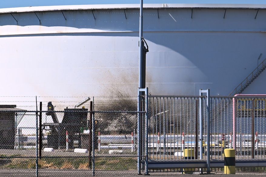 A structure in a refinery and fuel terminal run by Gunvor Energy carries the traces of an explosion at the Dutch port of Rotterdam which killed at least one person and injured several others according to police, in Rotterdam, Netherlands, Thursday, Aug. 13, 2026. (AP Photo/Mouneb Taim)