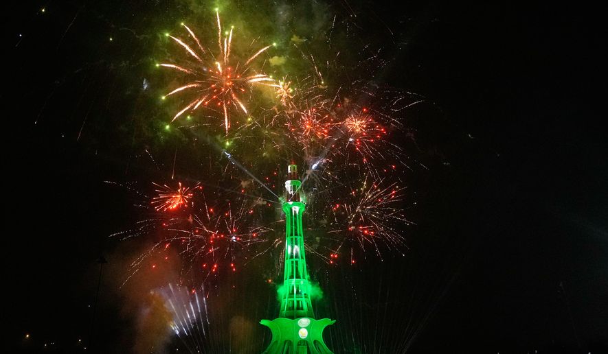 Fireworks light the sky over the Minar-e-Pakistan monument marking Independence Day in Lahore, Pakistan, Friday, Aug. 14, 2026. (AP Photo/K.M. Chaudary)