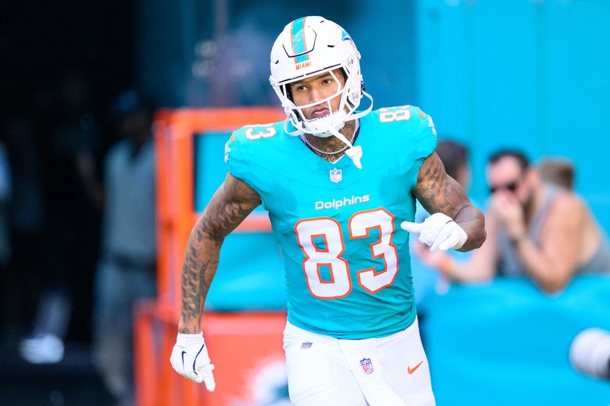 FILE - Miami Dolphins tight end Darren Waller (83) runs onto the field during player introductions before an NFL football game against the Tampa Bay Buccaneers, on Dec. 28, 2025, in Miami Gardens, Fla. (AP Photo/Doug Murray, File)