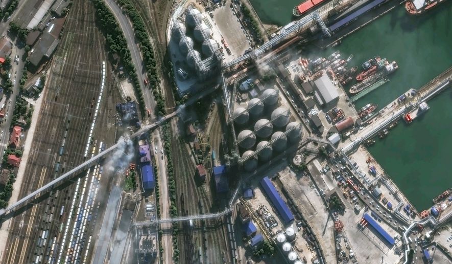 This image provided by Vantor shows smoke in an overview of port infrastructure in Novorossiysk, Russia, Wednesday, Aug. 12, 2026. (Satellite image ©2026 Vantor via AP)