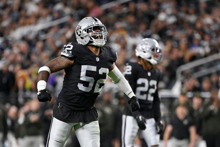 FILE - Las Vegas Raiders linebacker Elandon Roberts celebrates a defensive stop against the Dallas Cowboys during the first half of an NFL football game, Nov. 17, 2025, in Las Vegas. (AP Photo/David Becker, File)
