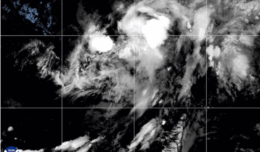 This NOAA satellite image taken at 11:04 a.m. EST on Thursday, Aug. 13, 2026, shows Tropical Storm Lala in the Pacific Ocean. (NOAA via AP)