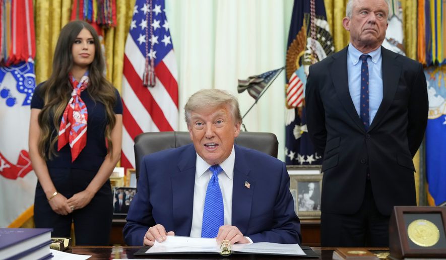 President Donald Trump speaks as Health and Human Services Secretary Robert F. Kennedy Jr., right, and Jayme Franklin listen during a meeting to sign an executive order about vaccines, Monday, Aug. 10, 2026, in the Oval Office of the White House in Washington. (AP Photo/Jacquelyn Martin)