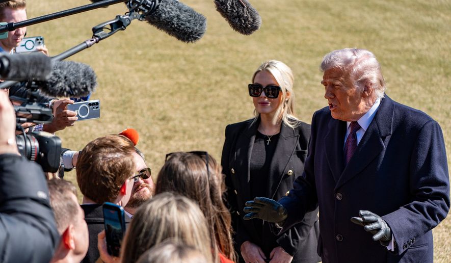 President Donald Trump, accompanied by White House press secretary Karoline Leavitt, speaks to reporters before departing on Marine One from the South Lawn of the White House, Feb. 27, 2026, in Washington. (AP Photo/Alex Brandon, File)