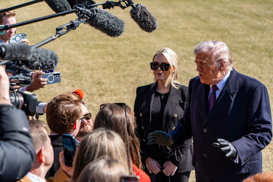 President Donald Trump, accompanied by White House press secretary Karoline Leavitt, speaks to reporters before departing on Marine One from the South Lawn of the White House, Feb. 27, 2026, in Washington. (AP Photo/Alex Brandon, File)