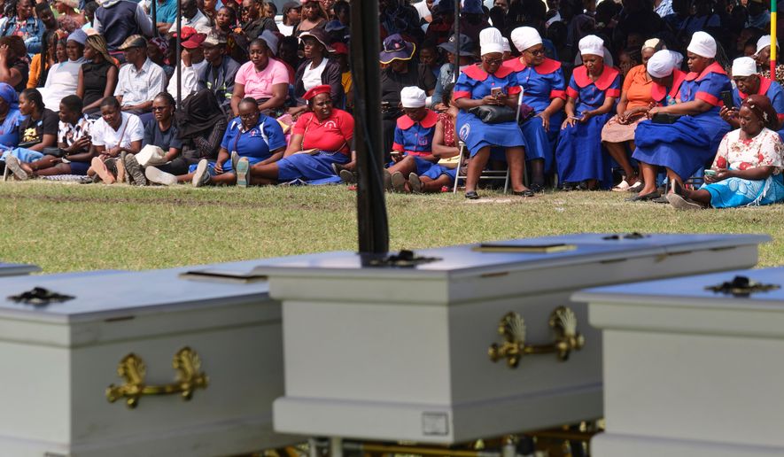 Mourners gather for a memorial service for the victims of a ferry capsized on lake Kariba in Kariba, Zimbabwe, Thursday, Aug. 13, 2026. (AP Photo/Mkhululi Thobela)