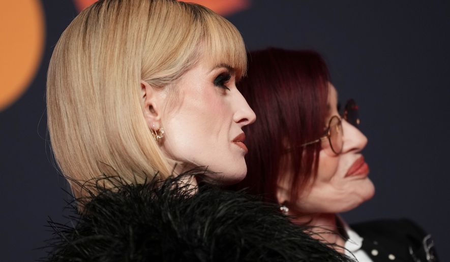 Kelly Osbourne, left and Sharon Osbourne pose for photographers upon arrival at the Brit Awards 2026 in Manchester, England, Saturday, Feb. 28, 2026. (Photo by Scott A Garfitt/Invision/AP)